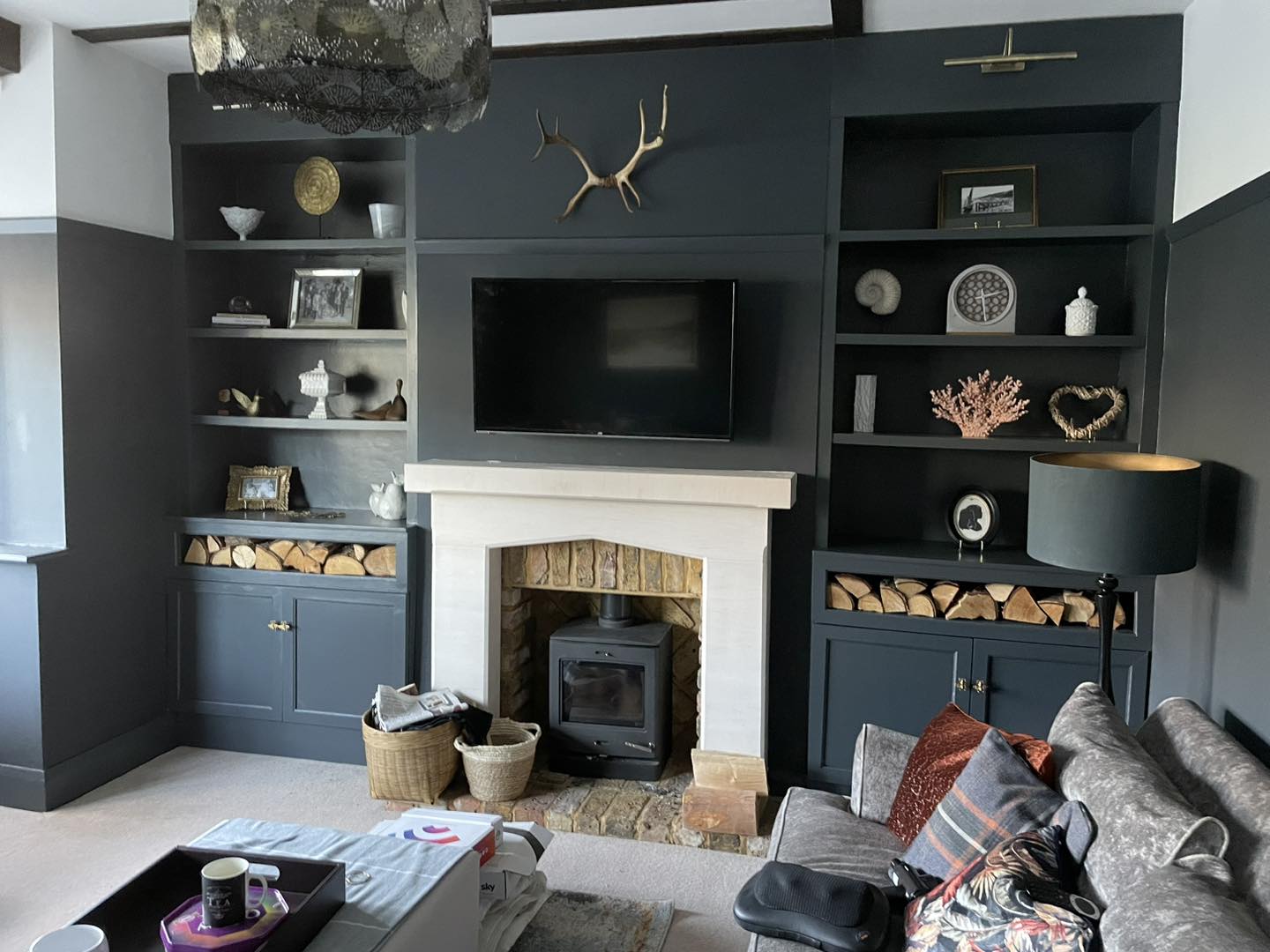 Fitted side shelves beside inset fire